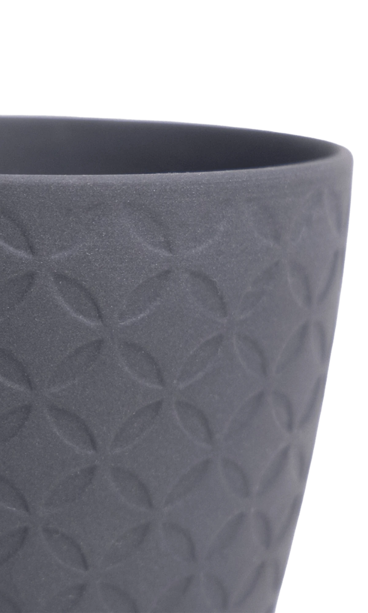Close-up of the Chive Virago B small black porcelain pot showing the color and textured finish.