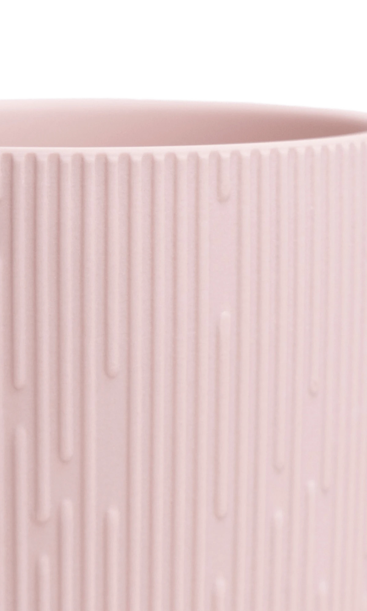 Close-up of the Chive Virago C small soft pink porcelain pot showing the color and ribbed texture finish.