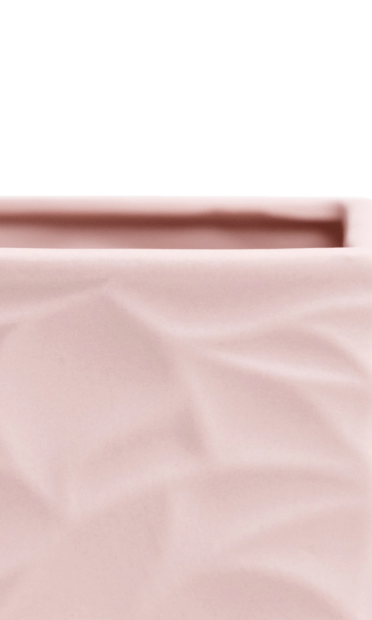 Close-up of the Chive Virago D medium soft pink porcelain pot showing the color and geometric texture.