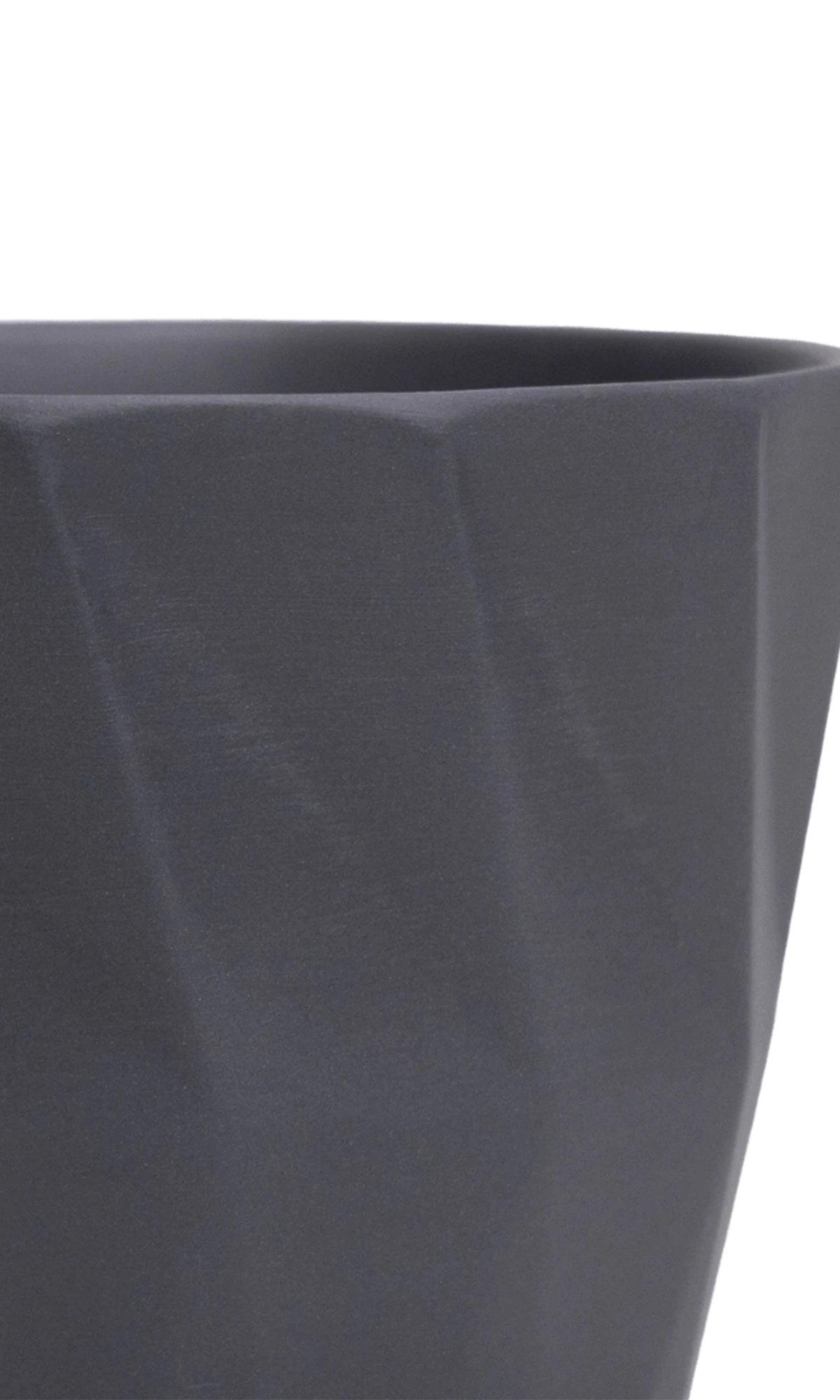 Close-up of the Chive Virago G small black porcelain pot showing the color and geometric texture.