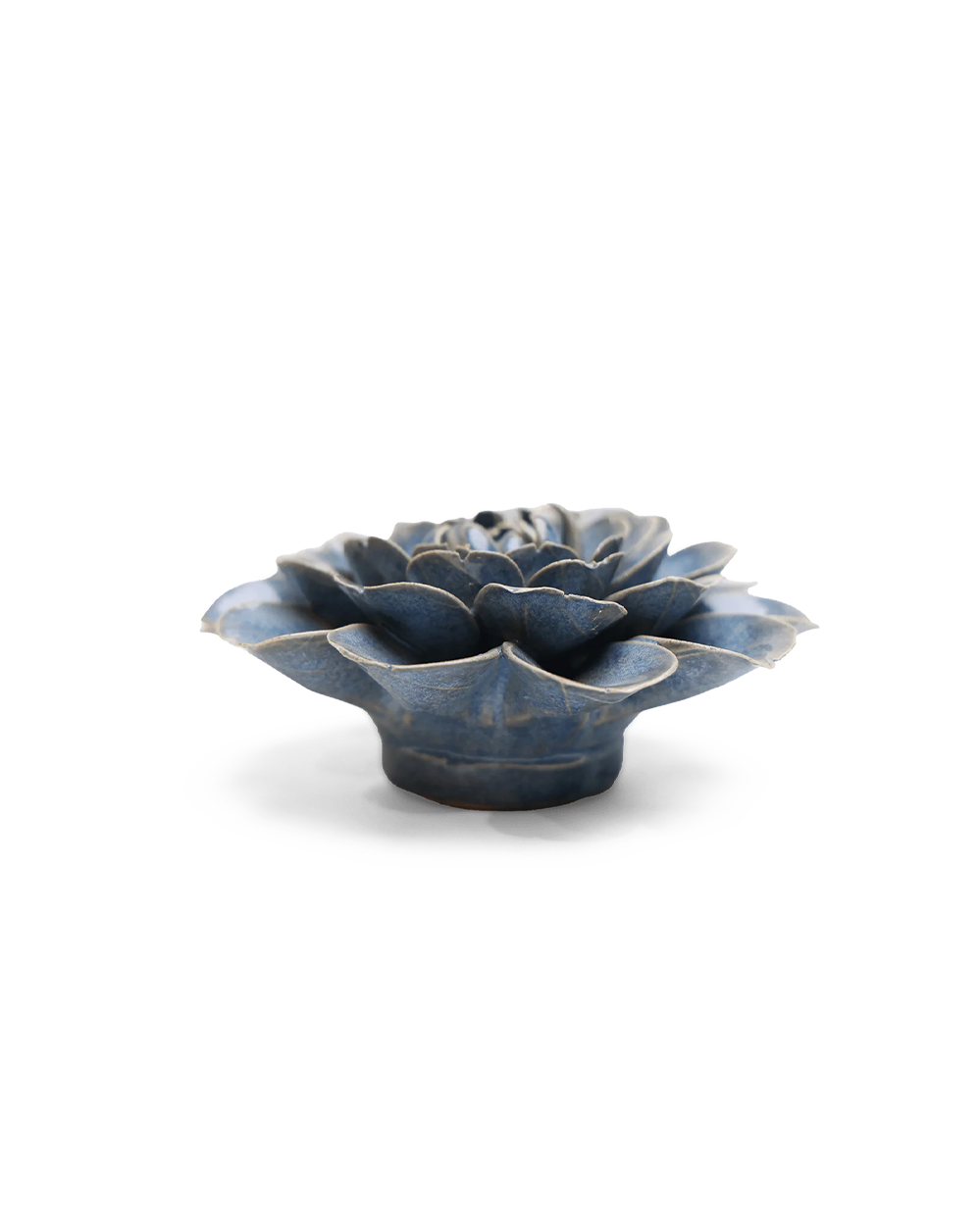 A small sculptural flower-shaped object with layered petals, shown on a clean white background. The item has a glossy dark blue glaze with lighter blue-gray highlights and a slightly distressed, rustic finish.