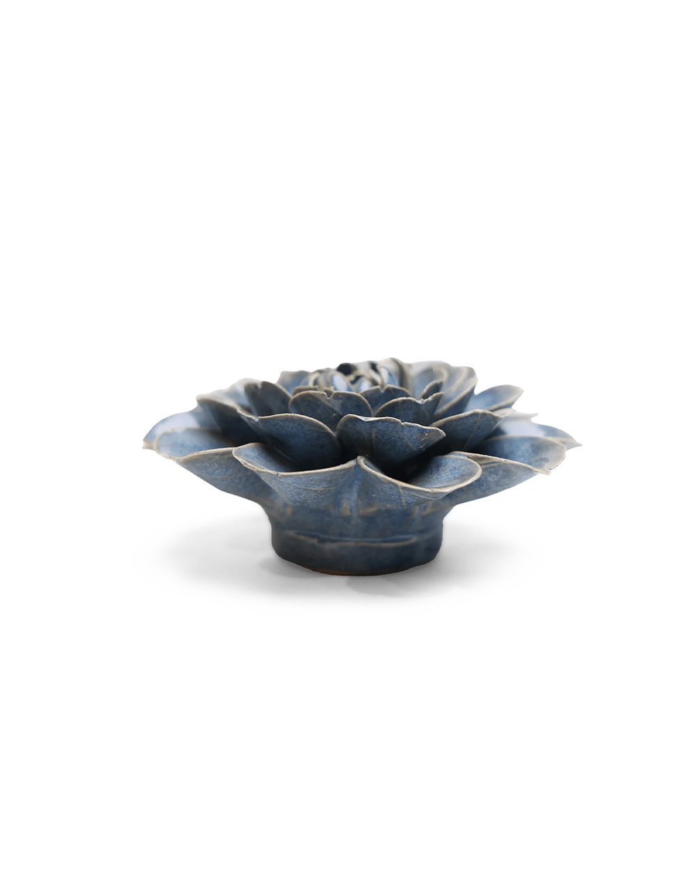A small sculptural flower-shaped object with layered petals, shown on a clean white background. The item has a glossy dark blue glaze with lighter blue-gray highlights and a slightly distressed, rustic finish.