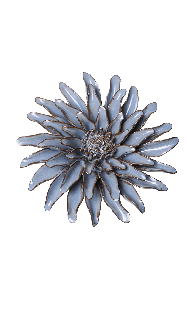 A single flower-shaped brooch with pale blue-gray petals outlined in gold, centered on a plain white background.