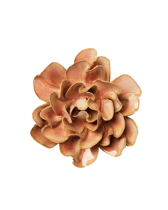 A single artificial flower bloom with layered ruffled petals in warm peach, tan, and light brown tones, isolated on a plain white background.