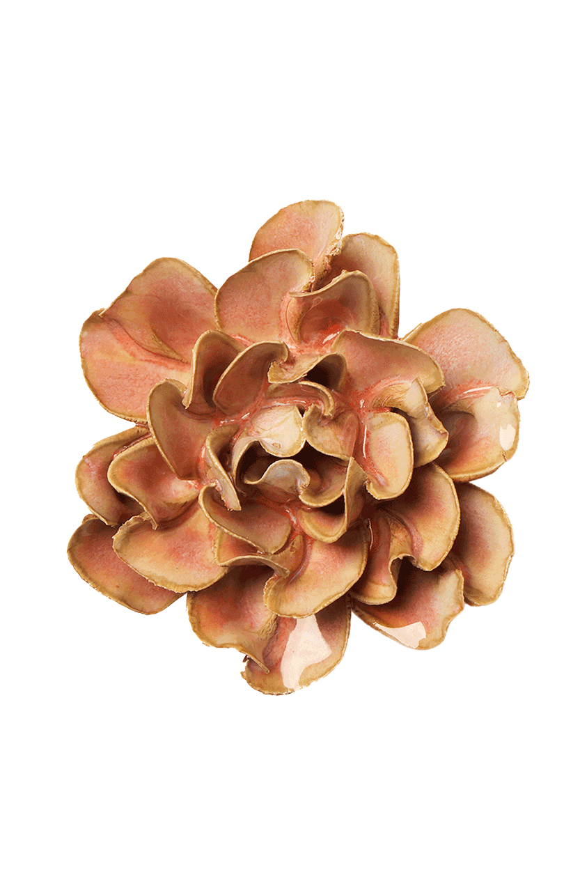 A single artificial flower bloom with layered ruffled petals in warm peach, tan, and light brown tones, isolated on a plain white background.