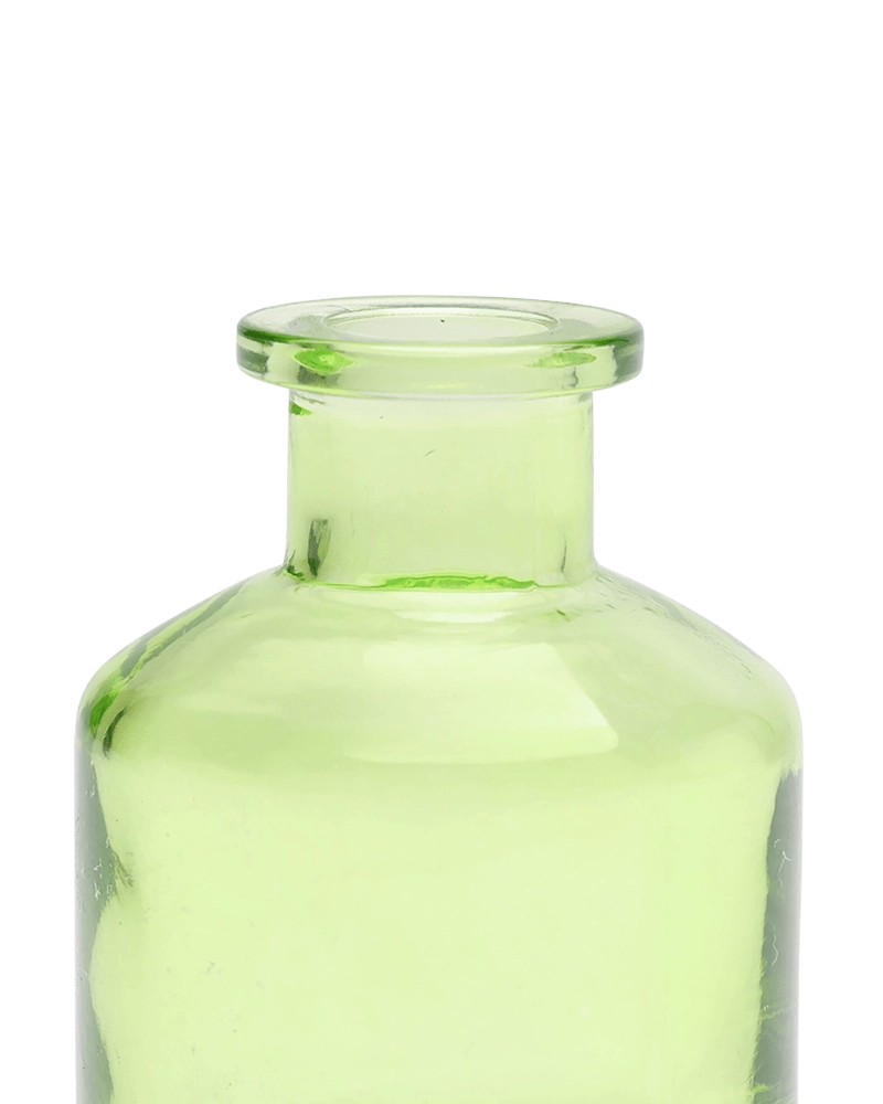 Chive Loft apothecary glass bud vase in green, close-up on the wide flared lip.