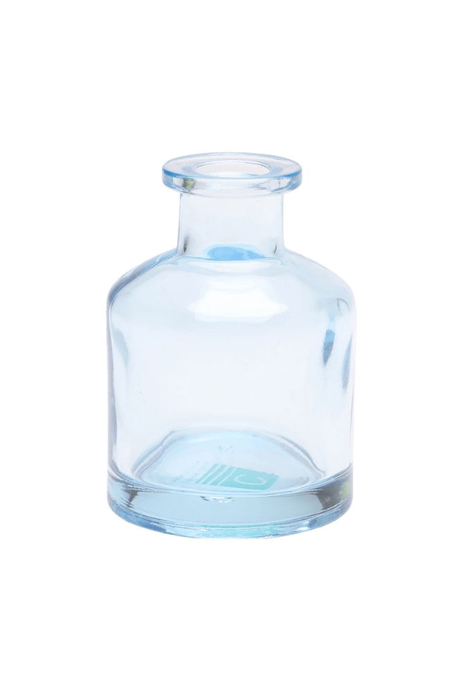 Chive Loft apothecary glass bud vase in light blue with a tall cylindrical silhouette and wide lip.