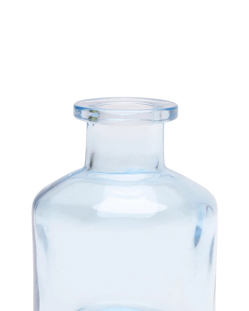 Chive Loft apothecary glass bud vase in light blue, close-up on the wide flared lip.