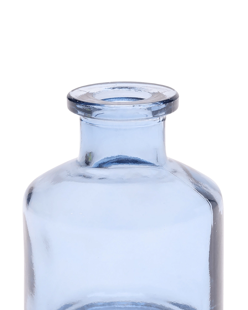 Chive Loft apothecary glass bud vase in medium blue, close-up on the wide flared lip.