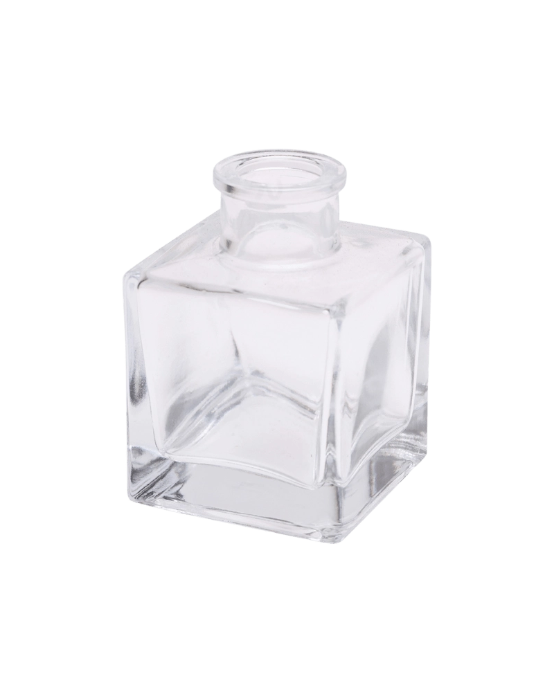 Chive Loft cube glass bud vase in clear glass, shown at an angle with a glossy faceted finish.
