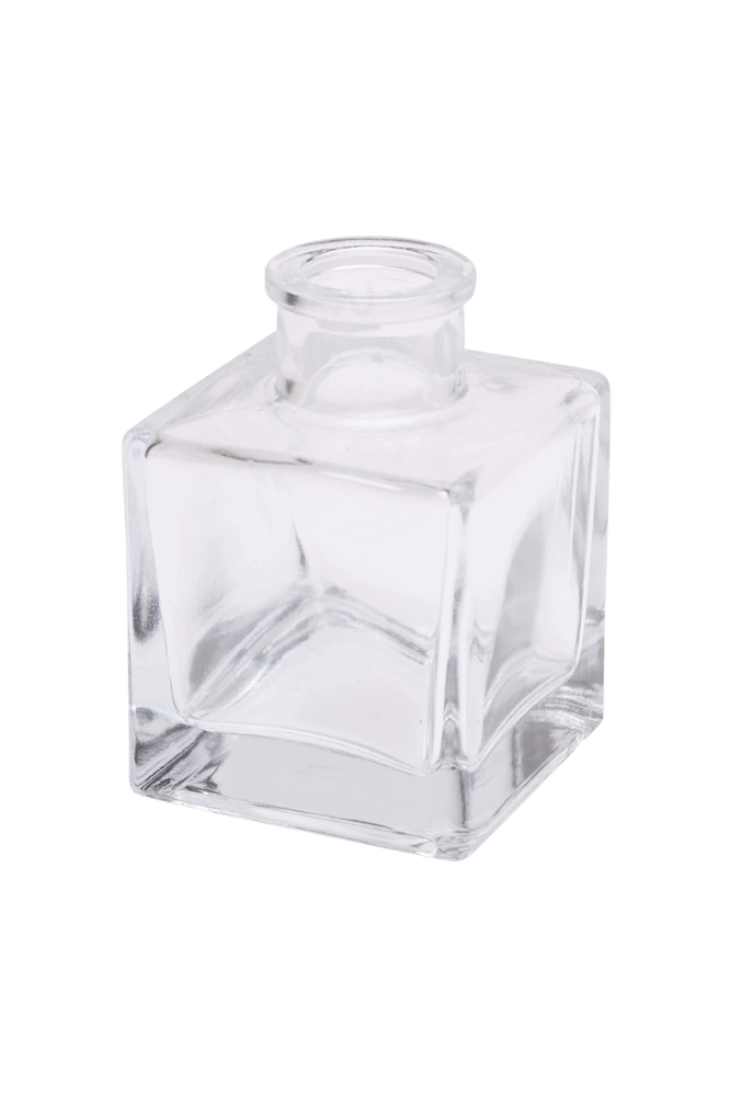 Chive Loft cube glass bud vase in clear glass, shown at an angle with a glossy faceted finish.