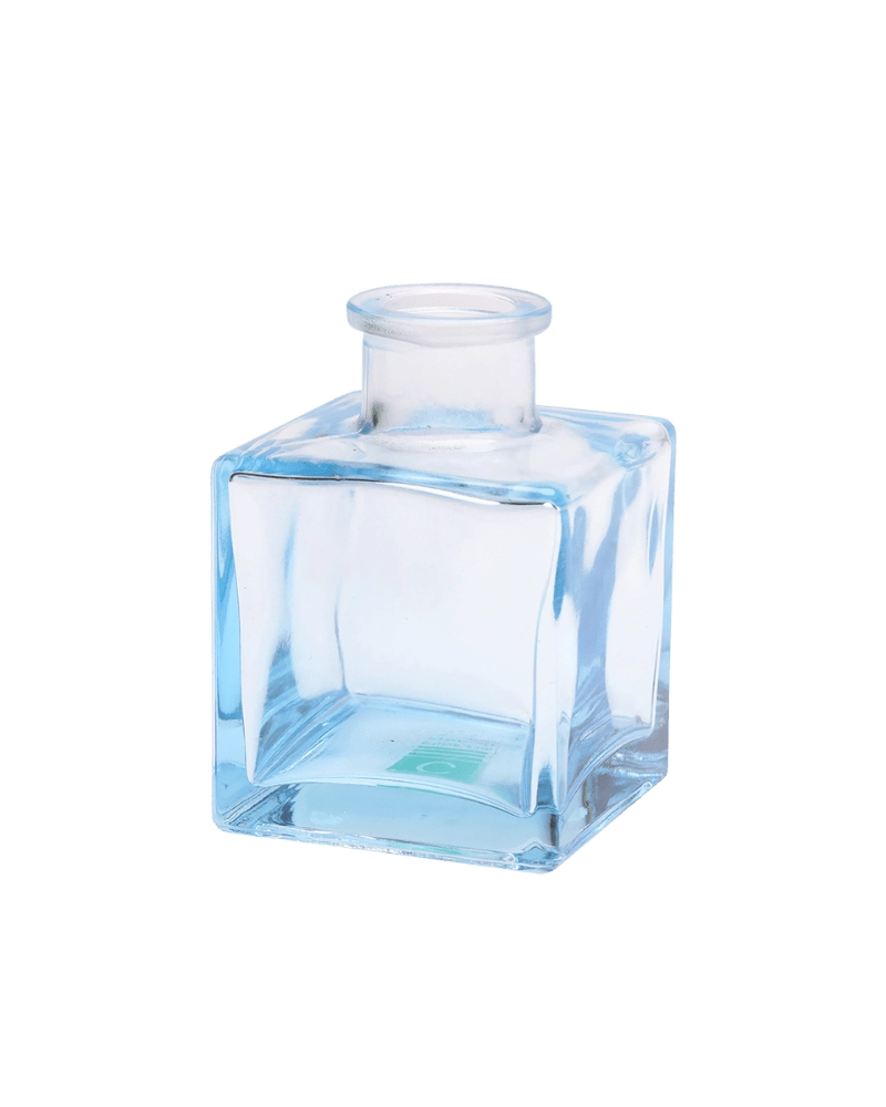 Chive Loft cube glass bud vase in light blue with a raised collar neck and clean square silhouette.