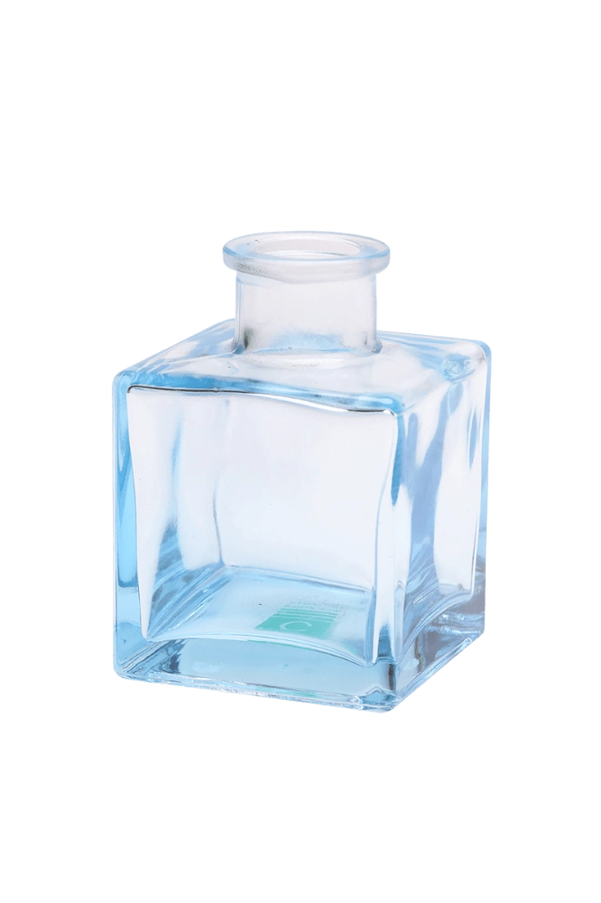 Chive Loft cube glass bud vase in light blue with a raised collar neck and clean square silhouette.