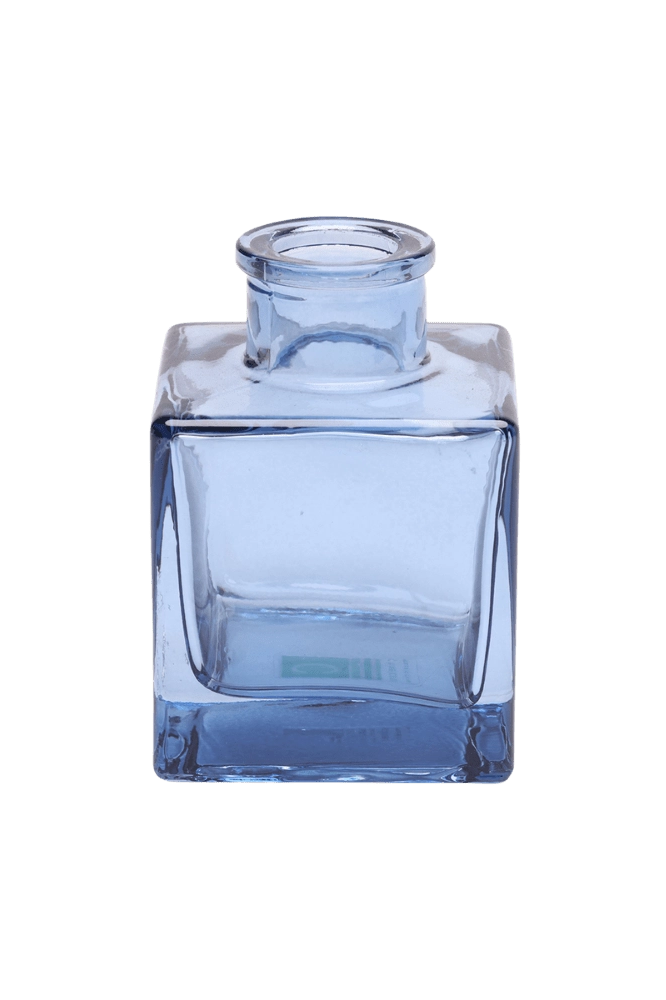 Chive Loft cube glass bud vase in medium blue with a raised collar neck and clean square silhouette.