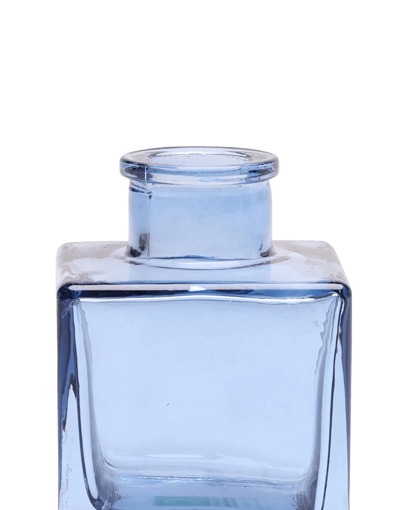 Chive Loft cube glass bud vase in medium blue, close-up on the raised collar neck.