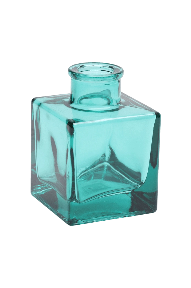 Chive Loft cube glass bud vase in teal, straight-on view highlighting the sharp square edges.