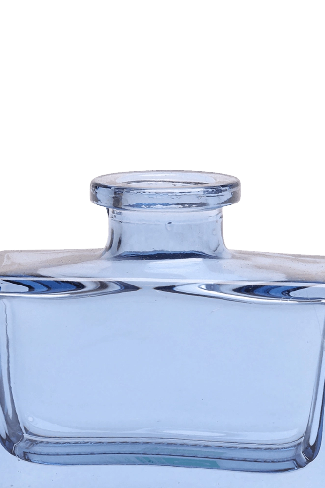 Chive Loft square glass bud vase in blue-grey, close-up on the narrow neck and thick glass base.