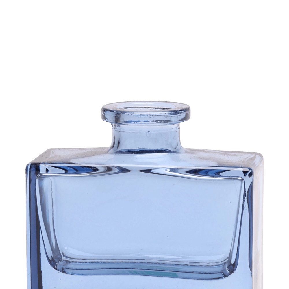 Chive Loft square glass bud vase in blue-grey, close-up on the narrow neck and thick glass base.