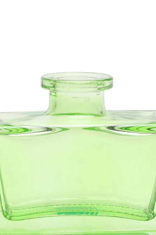 Chive Loft square glass bud vase in green, close-up on the narrow neck and thick glass base.