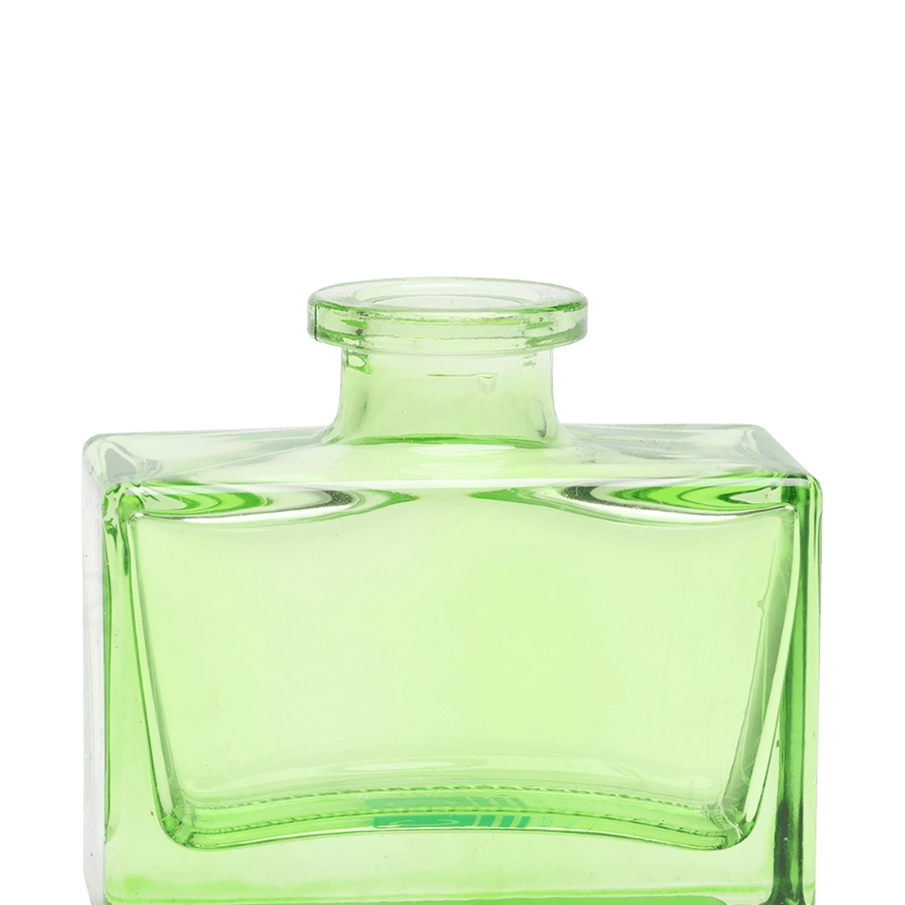 Chive Loft square glass bud vase in green, close-up on the narrow neck and thick glass base.