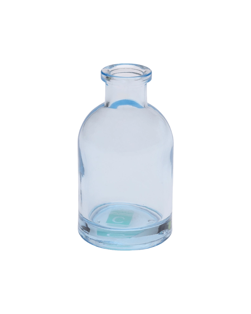 Chive Loft tall glass bud vase in light blue with a slender neck and rounded shoulder.