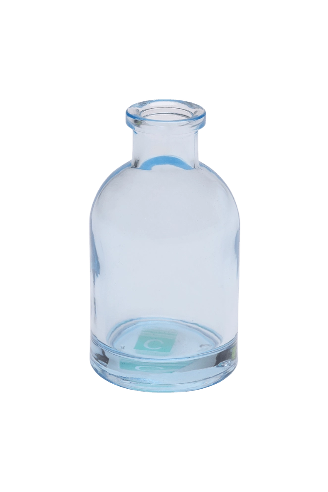 Chive Loft tall glass bud vase in light blue with a slender neck and rounded shoulder.