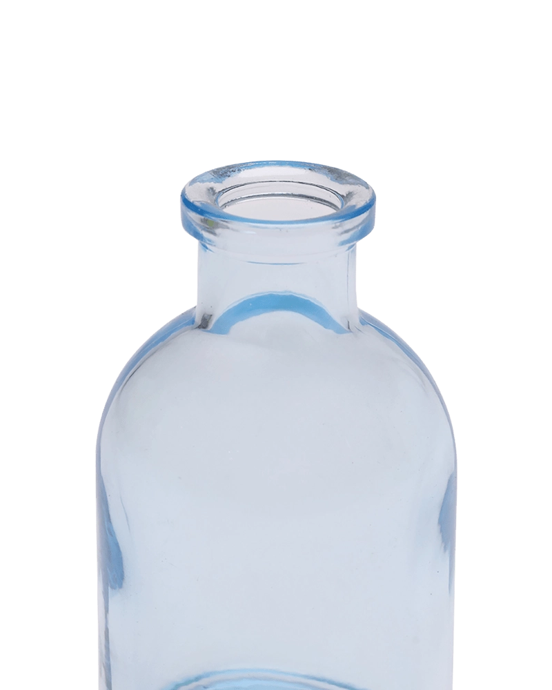 Chive Loft tall glass bud vase in light blue, close-up on the narrow neck and rim.