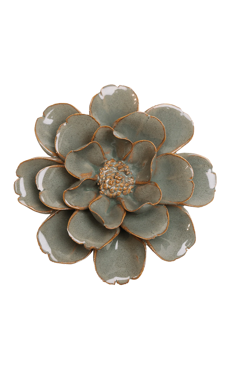 A ceramic succulent flower figurine with layered green-gray petals and a warm brown rim, shown on a plain white background.