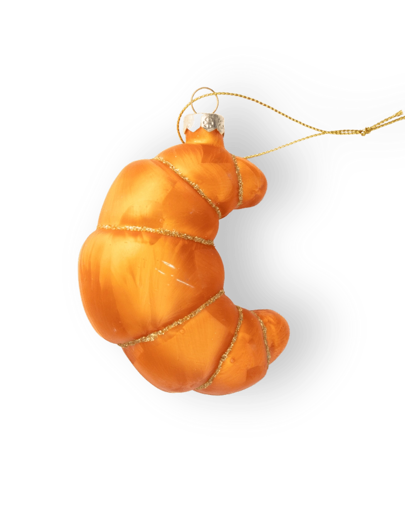 Chive glass croissant ornament in orange with a gilded thread hanger.