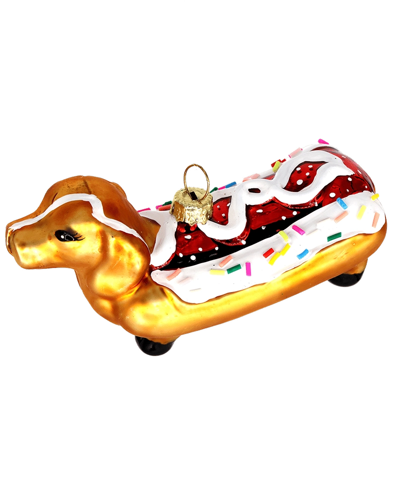 Chive glass dachshund ornament shown at an angle highlighting the sprinkled icing.