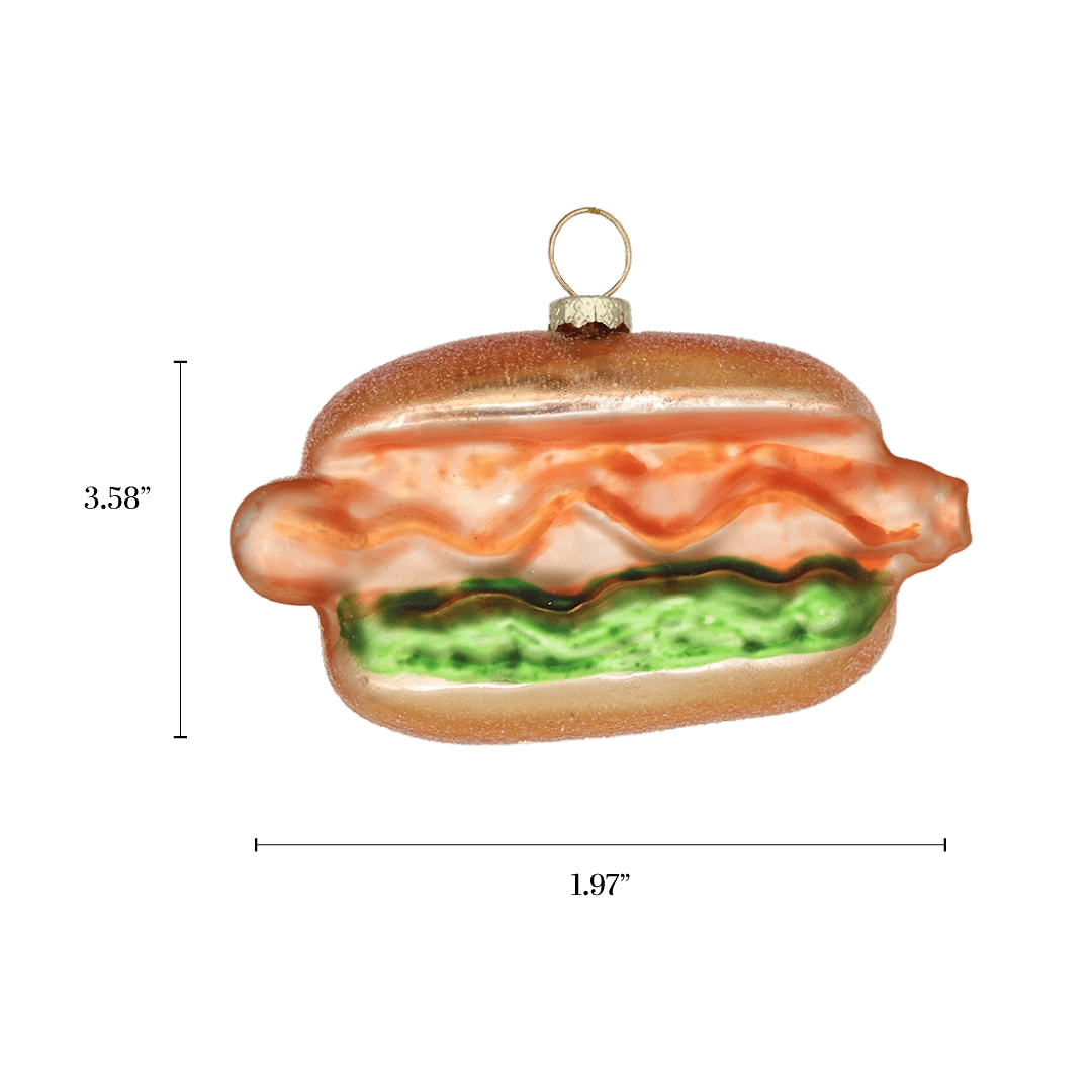 Chive glass hot dog ornament with a dimension diagram showing its wide bun shape.