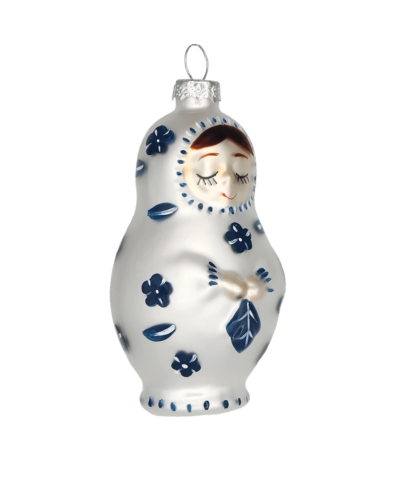 Chive glass matryoshka doll ornament in white with navy floral folk art detail.