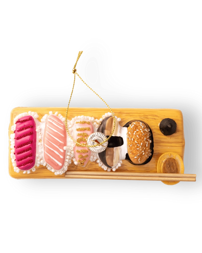 Chive glass sushi board ornament, overhead view of assorted nigiri toppings.