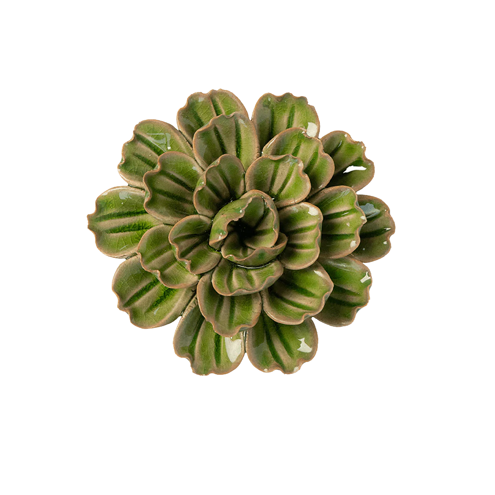 A ceramic petunia plant with green glazed leaves and brown clay edges, photographed from directly above on a plain white background.