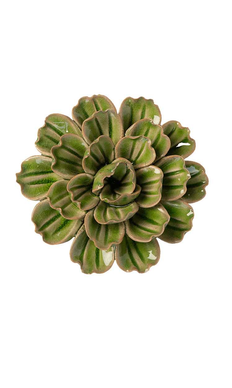A ceramic petunia plant with green glazed leaves and brown clay edges, photographed from directly above on a plain white background.