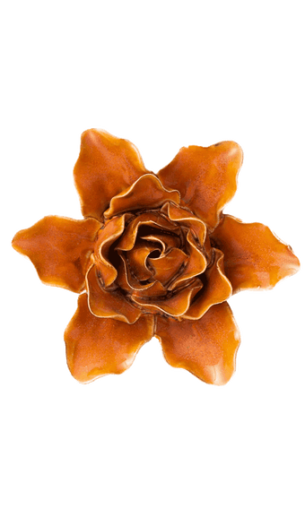 An orange-brown ceramic flower-shaped object, resembling a stylized rose or dahlia, centered on a plain white background.
