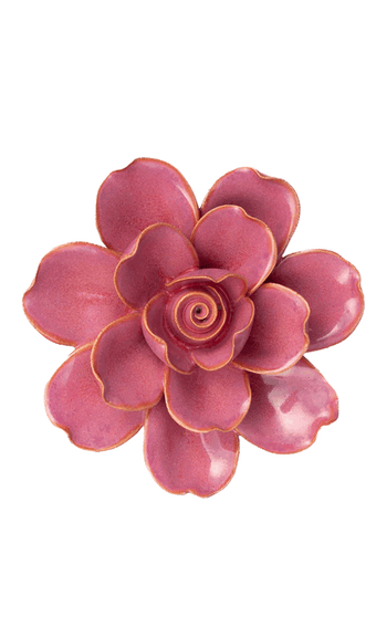 A single artificial-looking flower with layered petals in a dusty rose pink color, outlined with a thin metallic gold edge, isolated on a solid black background.