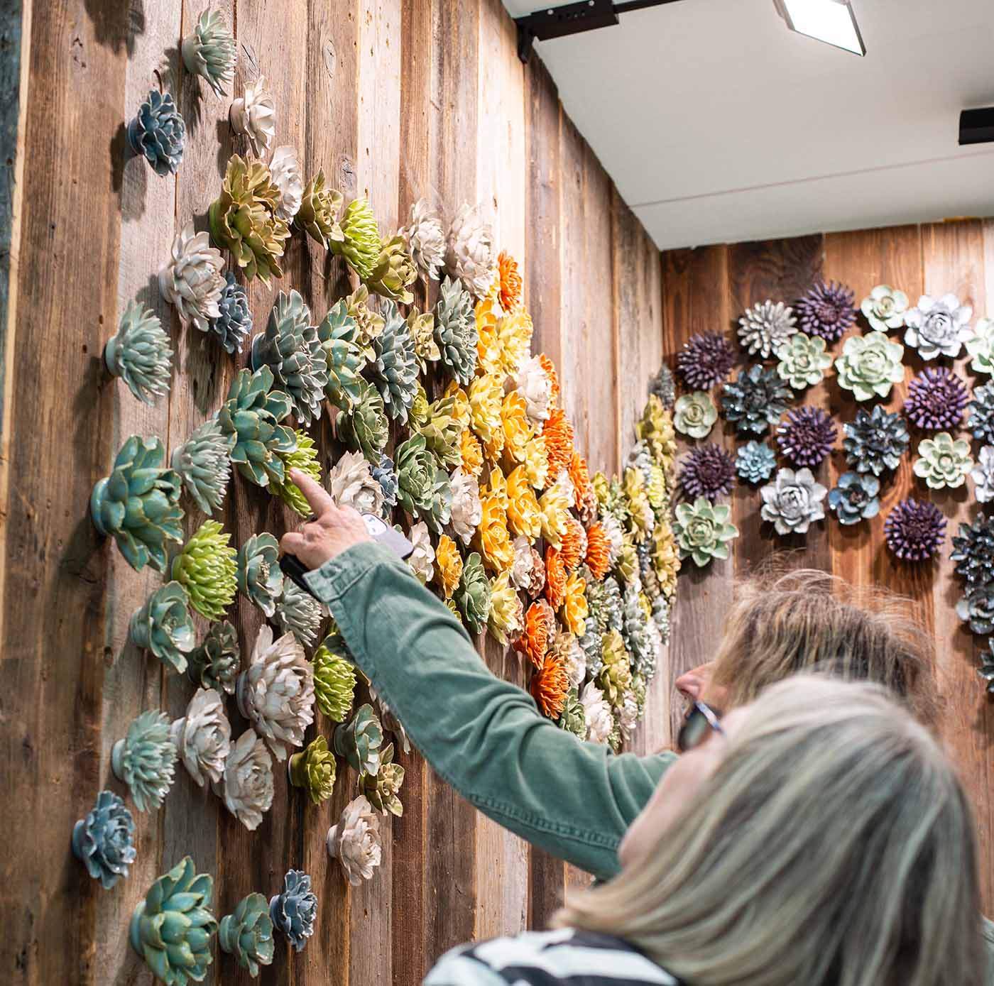 Chive at the RHS Chelsea Flower Show 2026, featuring a wall of ceramic flowers