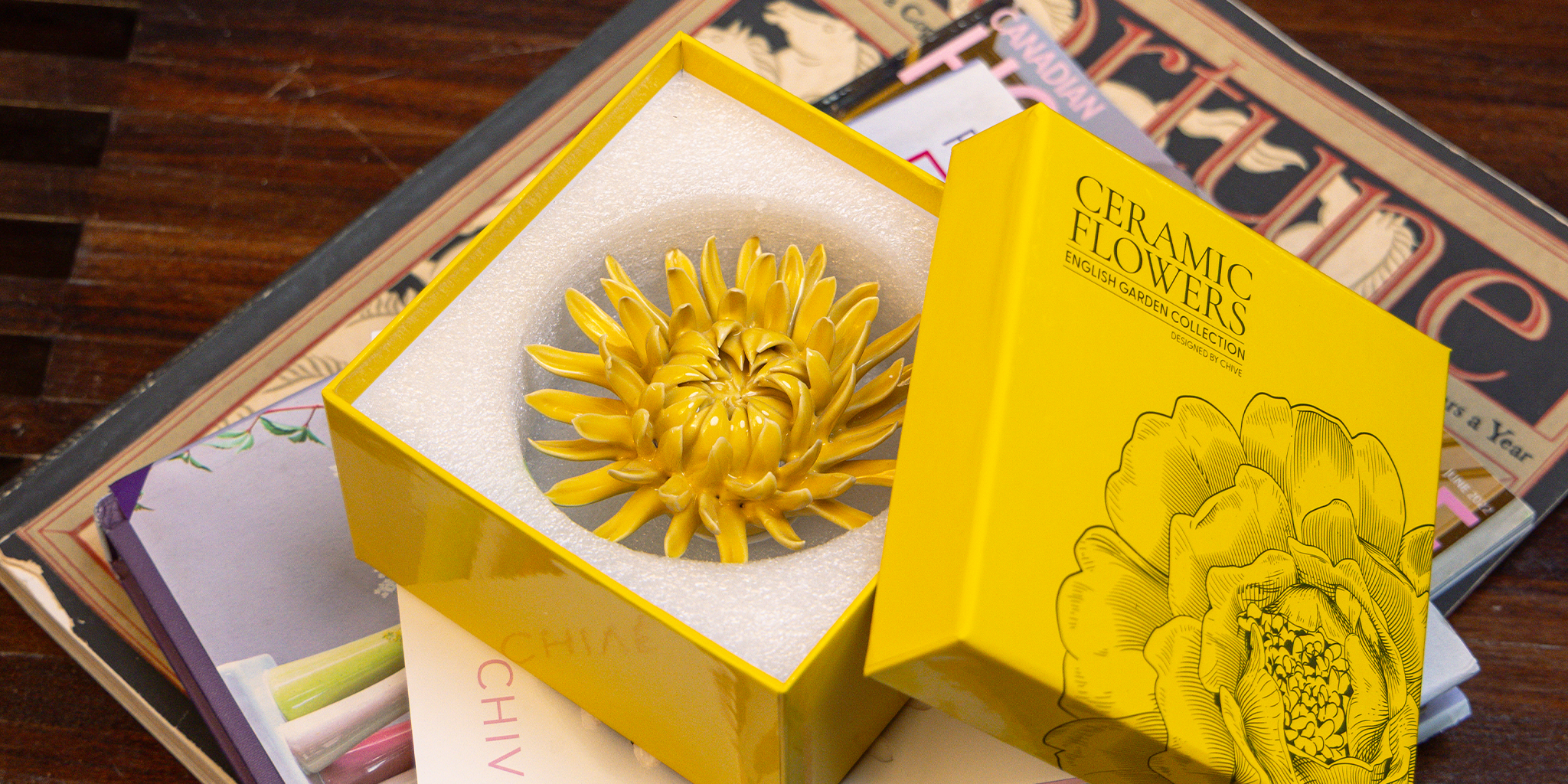 Chive ceramic Marigold in gift-ready packaging, presented in an open gift box