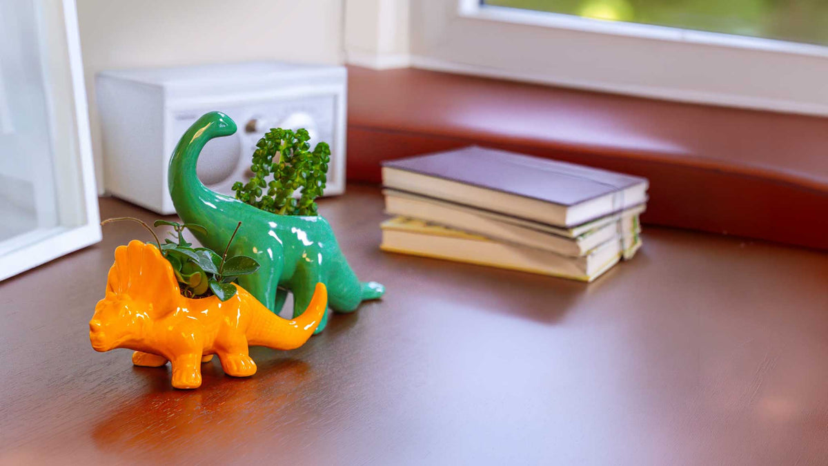 Unique ceramic pots shaped like animals, holding succulents — by Chive Studio