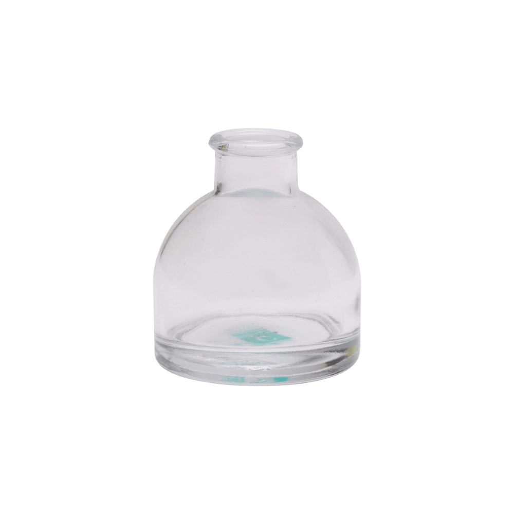Chive Loft round glass bud vase in clear glass with a domed silhouette and short neck.