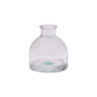 Chive Loft round glass bud vase in clear glass with a domed silhouette and short neck.