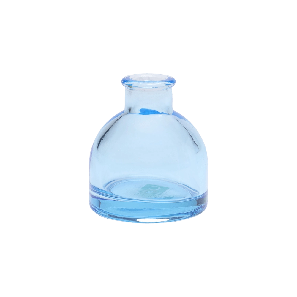 Chive Loft round glass bud vase in light blue with a domed silhouette and short neck.