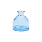 Chive Loft round glass bud vase in light blue with a domed silhouette and short neck.
