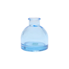 Chive Loft round glass bud vase in light blue, shown straight-on with a smooth glossy finish.