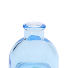 Chive Loft round glass bud vase in light blue, close-up on the flared neck and rim.