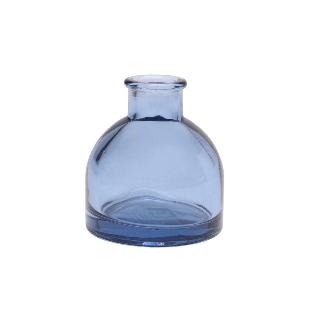 Chive Loft round glass bud vase in medium blue with a domed silhouette and short neck.