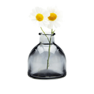 Chive Loft round glass bud vase in smoke grey styled with two small white daisy blooms.