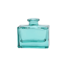 Chive Loft glass bud vase in Teal shows a rectangular jar with a narrow round neck, front-facing.