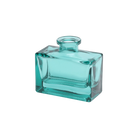 Chive Loft glass bud vase in Teal rotates to reveal the rectangular jar's angled corner detail.